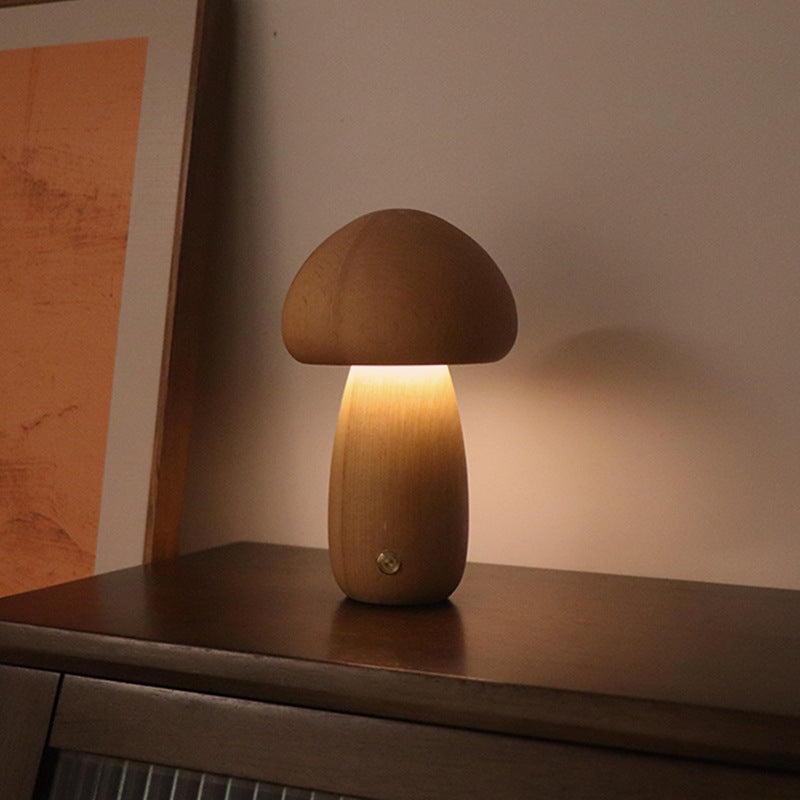 Beech mushroom lamp on a wooden surface with a warm glow.