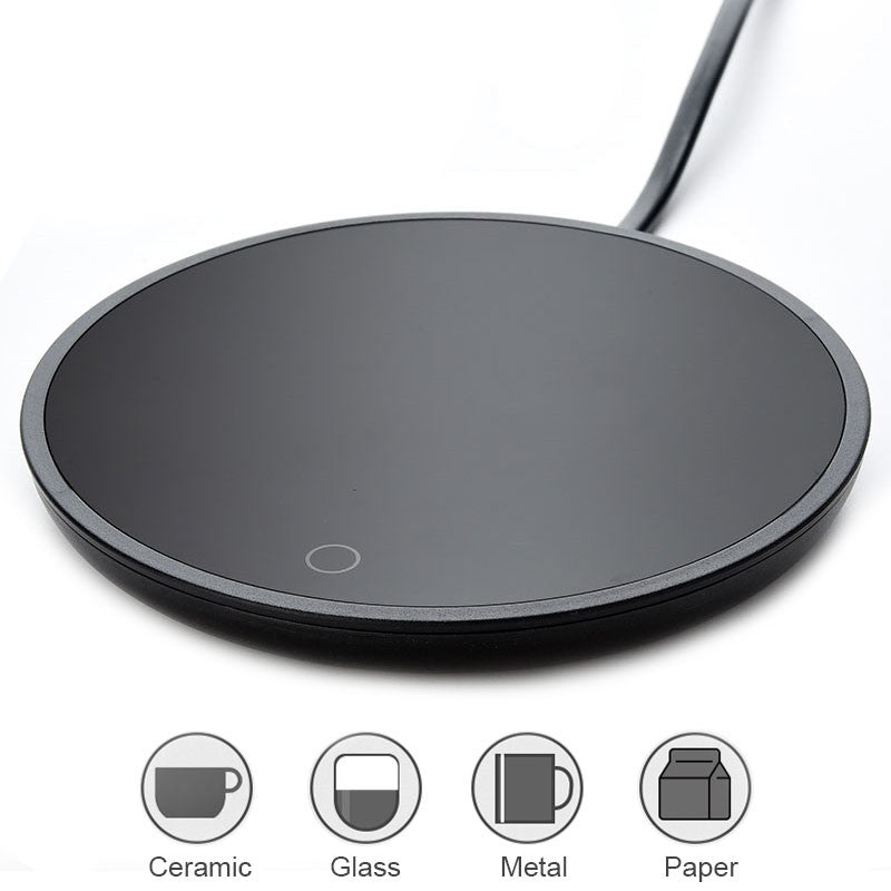 Black round induction cooktop with icons indicating material compatibility on white background.