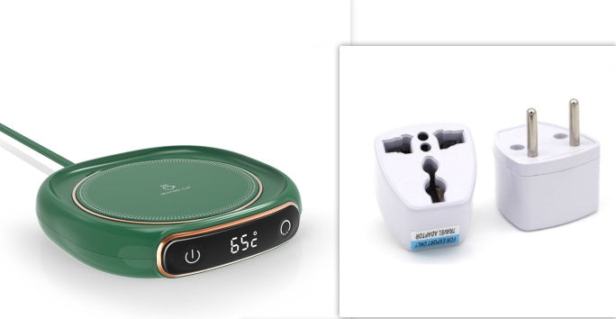 Green electronic device with digital display and two white plugs on a white background.