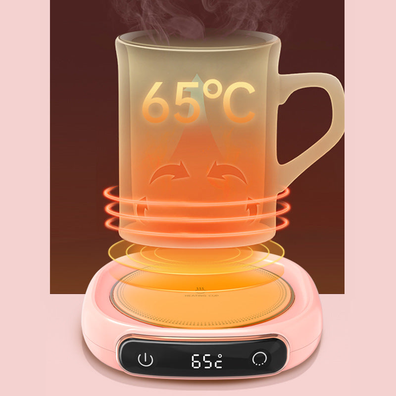 Heated mug with digital display on a pink background.