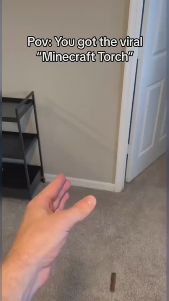 LED wall lamp beingturned on, removed from wall and carried in hand in dark room.