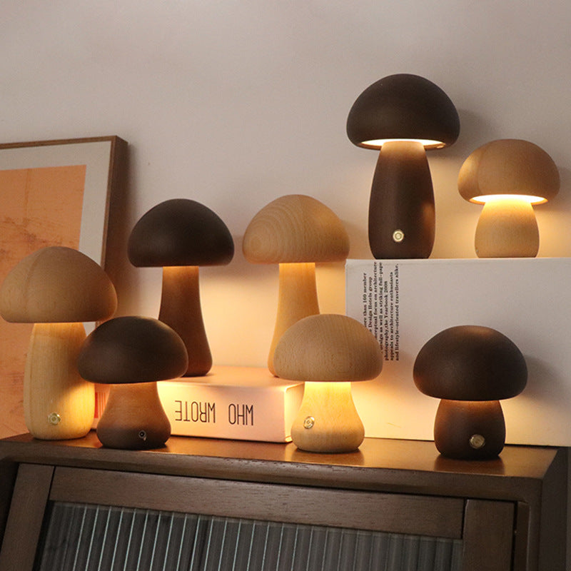 Set of mushroom-shaped lamps on a wooden surface with a neutral background.