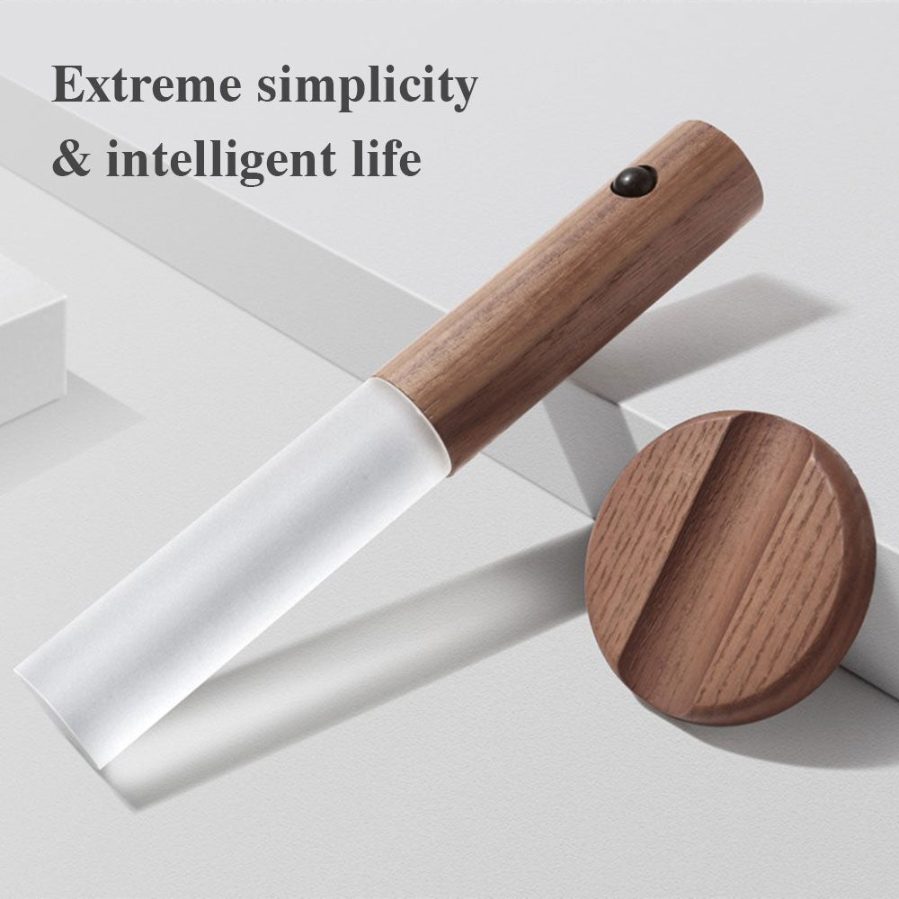 Wooden tool with white blade on a light gray background, featuring text «Extreme simplicity & intelligent life».