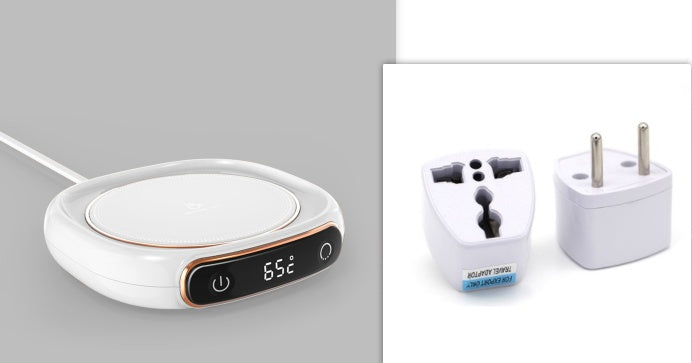 White electronic device with digital display and power adapter on a gray background.